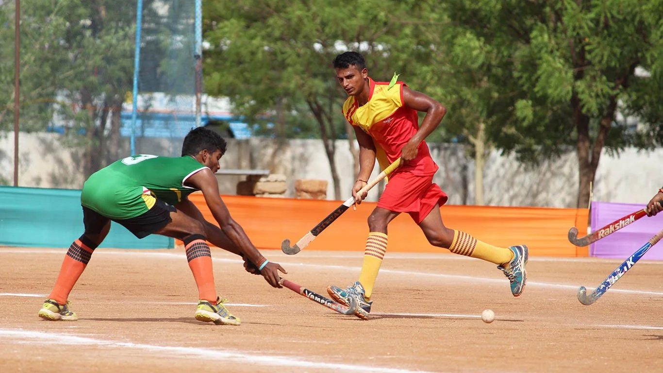 Two ASA hockey players contesting the ball