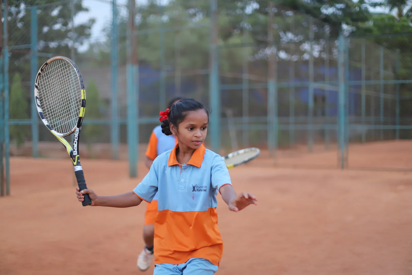 A young player at ASA practising tennis